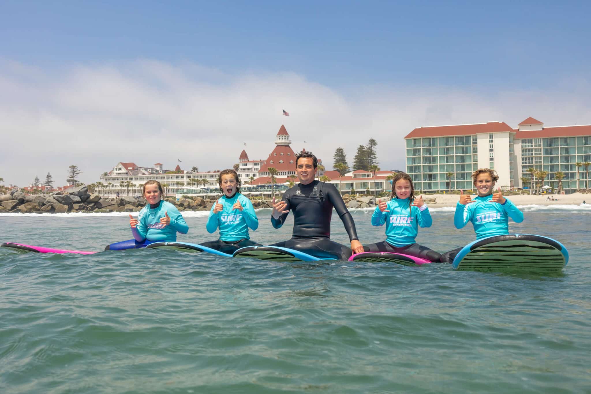Imran Khan et al. rowing a boat in the water