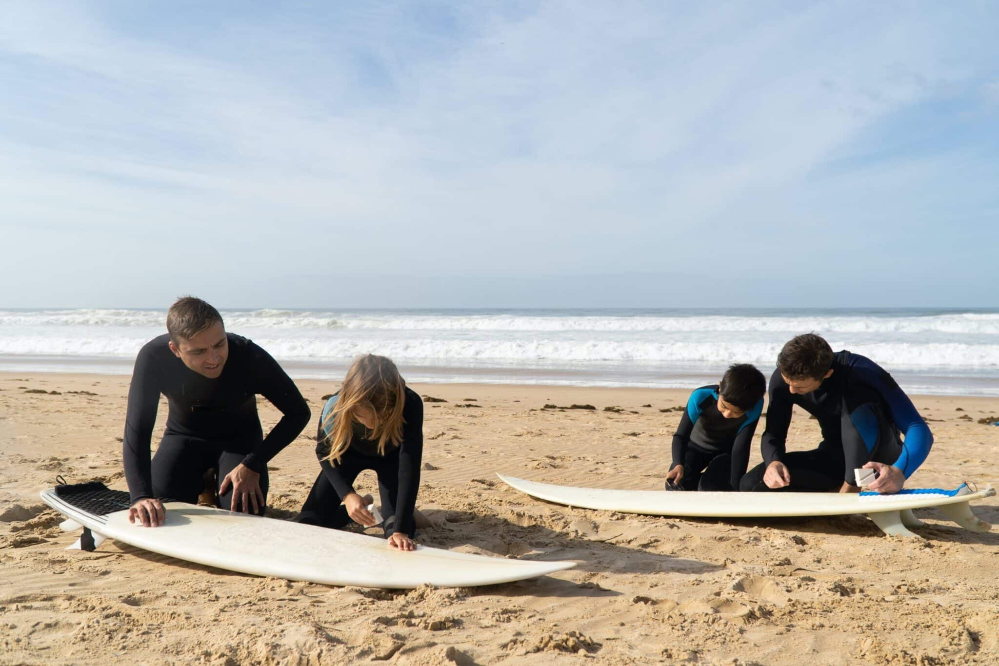 a group of people sitting at a beach