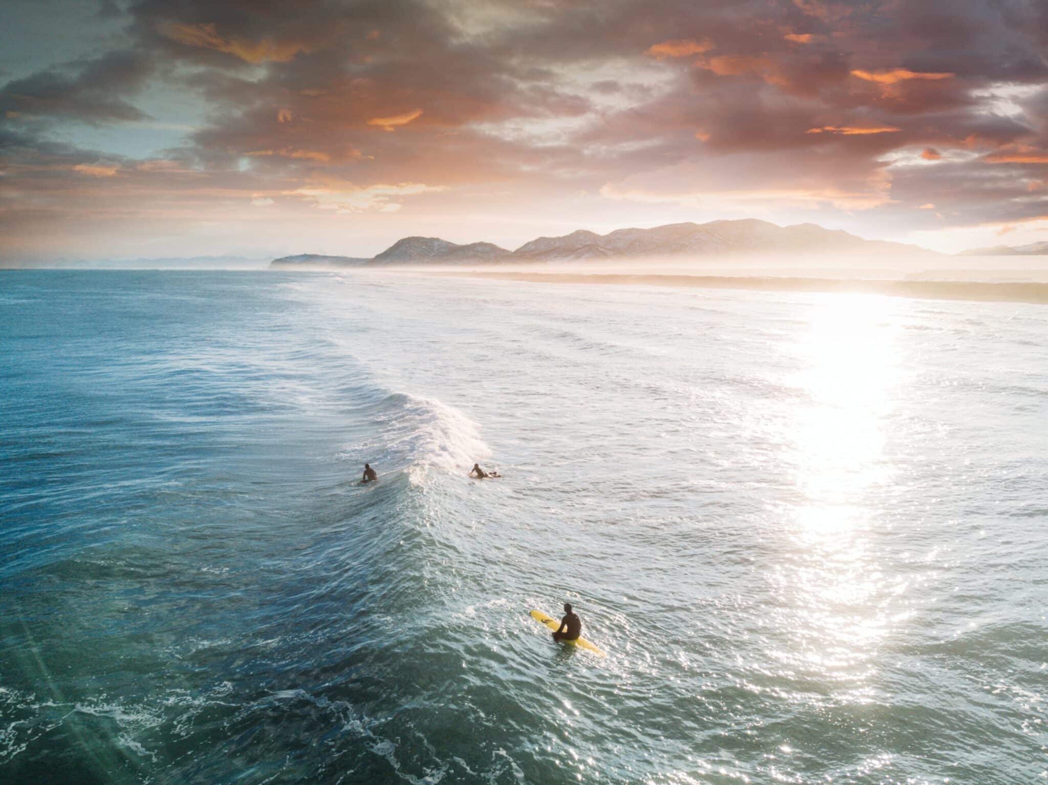 a man riding a wave on a surfboard in the ocean