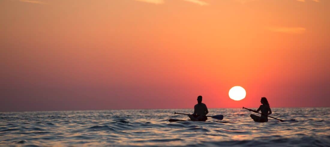 a sunset over some water