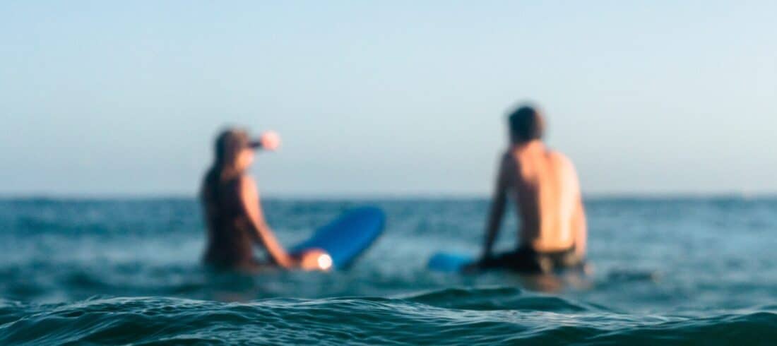 a man riding a wave on a surfboard in the water