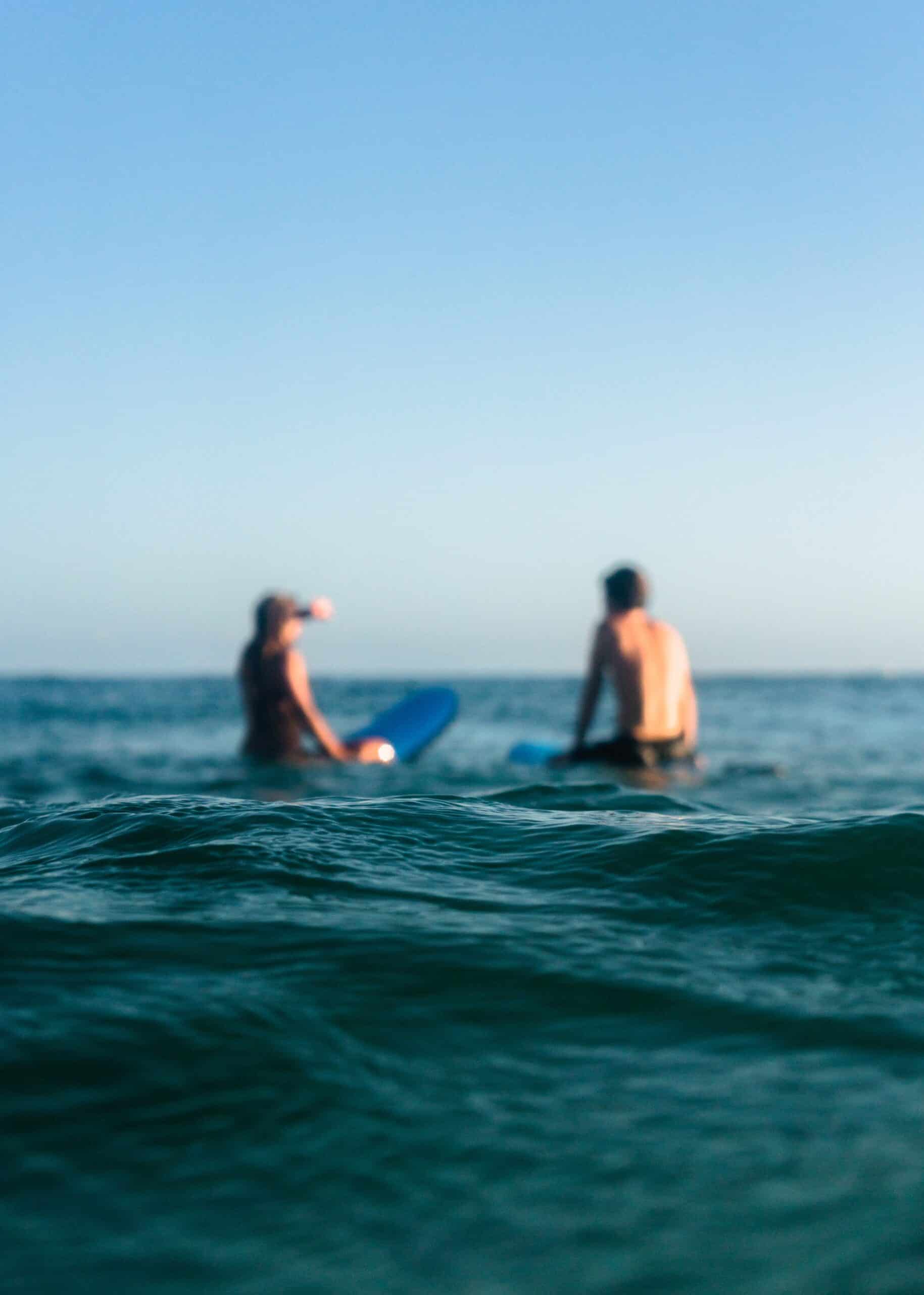 a man riding a wave on a surfboard in the water